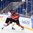 SOCHI, RUSSIA - APRIL 22: Canada's Yan Laplante #14 bodychecks Switzerland's Patrik Brandli #11 behind the Swiss net during preliminary round action at the 2013 IIHF Ice Hockey U18 World Championship. (Photo by Matthew Murnaghan/HHOF-IIHF Images)